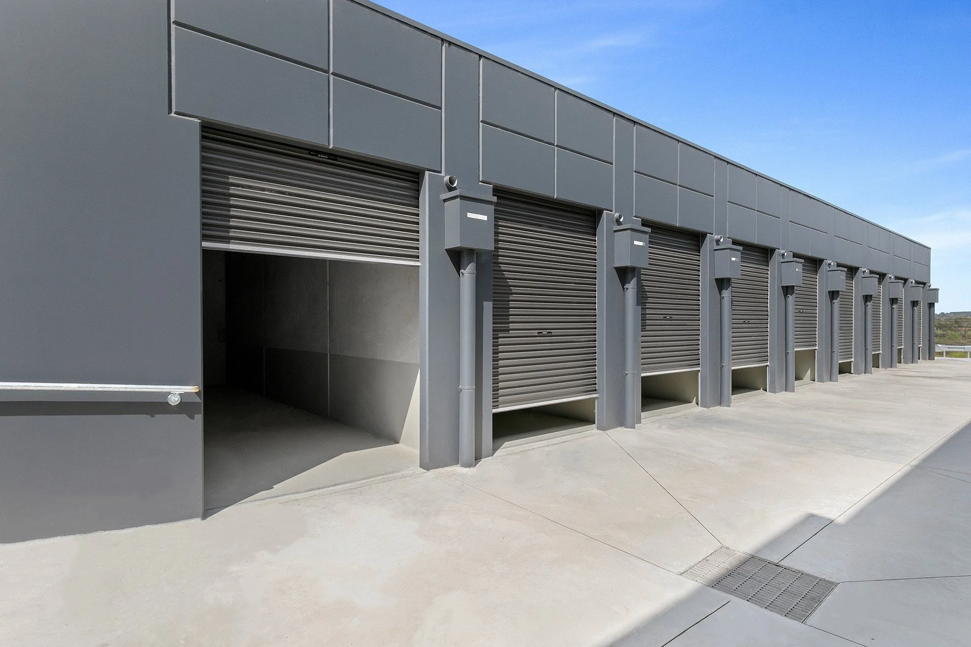 AlterSpaces Breakwater storage units with roller doors, one open to show the interior